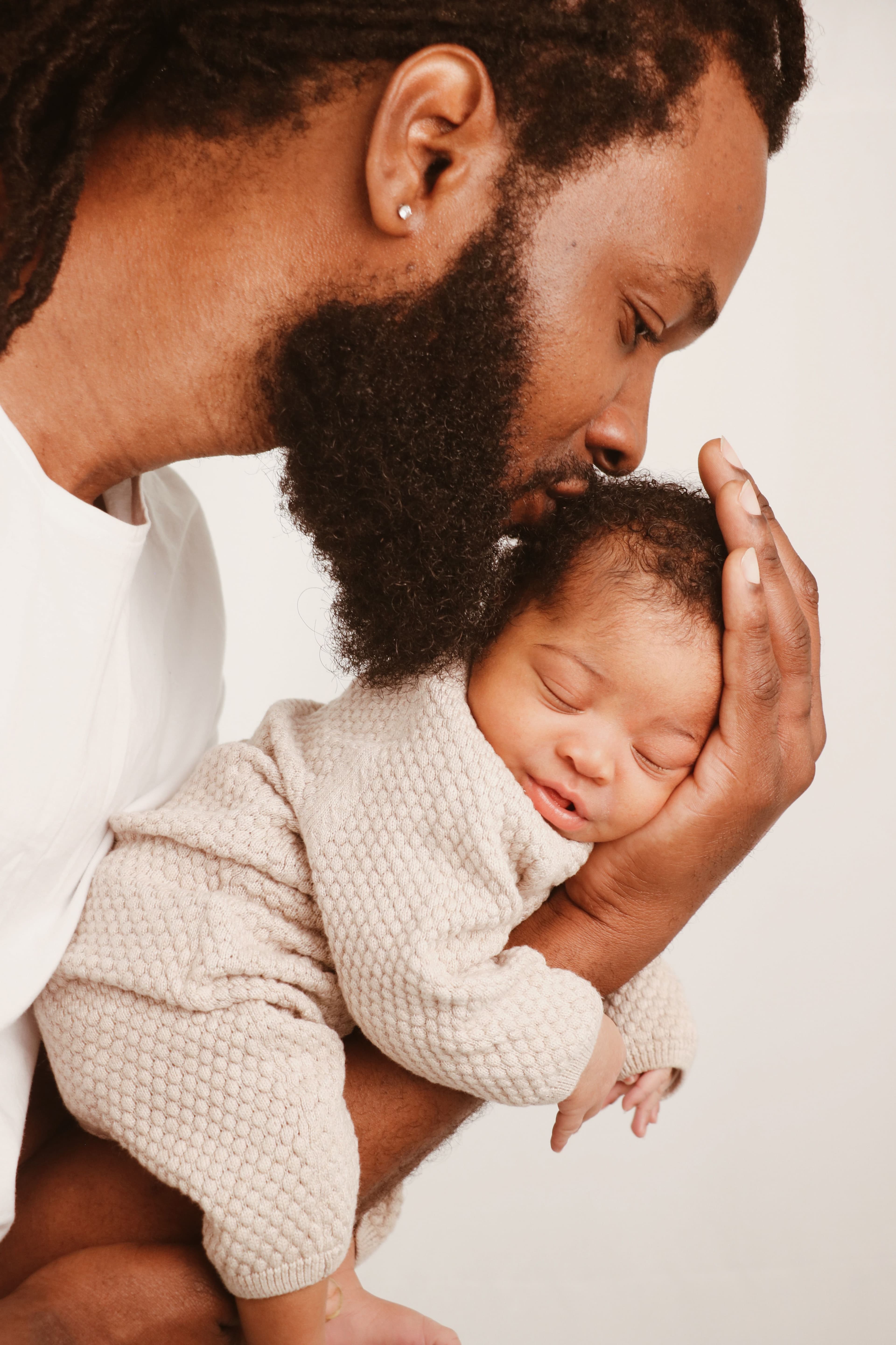 Beautiful stylish blonde woman in trench coat looking away dreamily